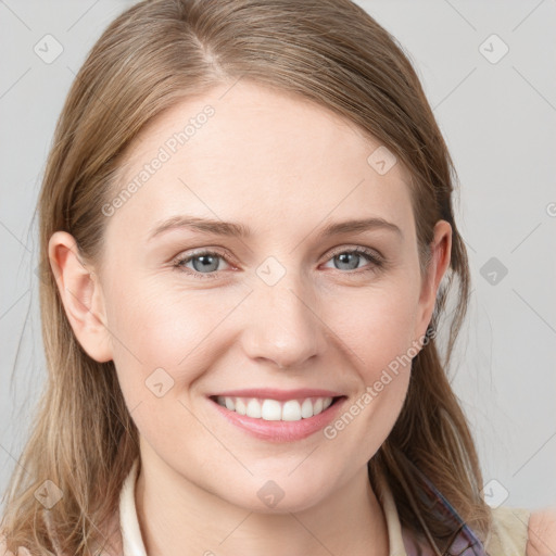 Joyful white young-adult female with medium  brown hair and blue eyes