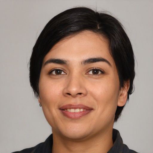 Joyful asian young-adult female with medium  black hair and brown eyes