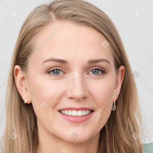 Joyful white young-adult female with long  brown hair and blue eyes