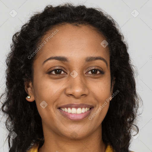 Joyful black young-adult female with long  brown hair and brown eyes