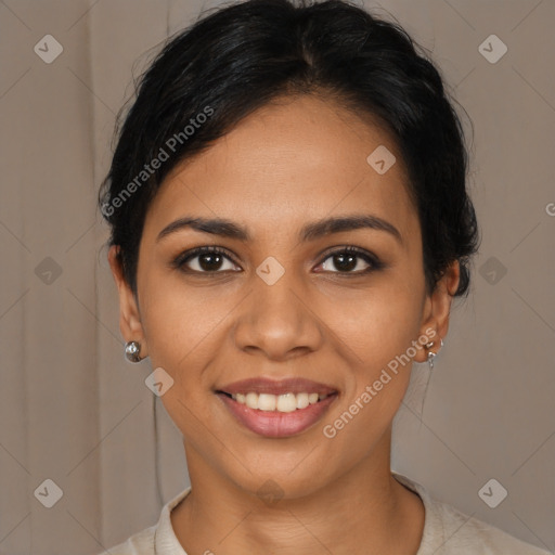 Joyful latino young-adult female with medium  brown hair and brown eyes