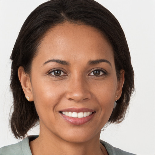 Joyful white young-adult female with medium  brown hair and brown eyes