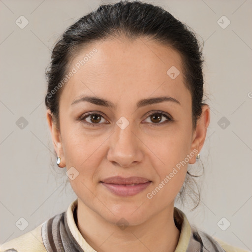 Joyful white adult female with medium  brown hair and brown eyes