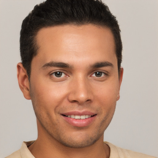 Joyful white young-adult male with short  brown hair and brown eyes