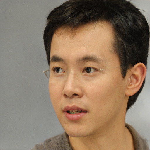 Neutral asian young-adult male with short  brown hair and brown eyes
