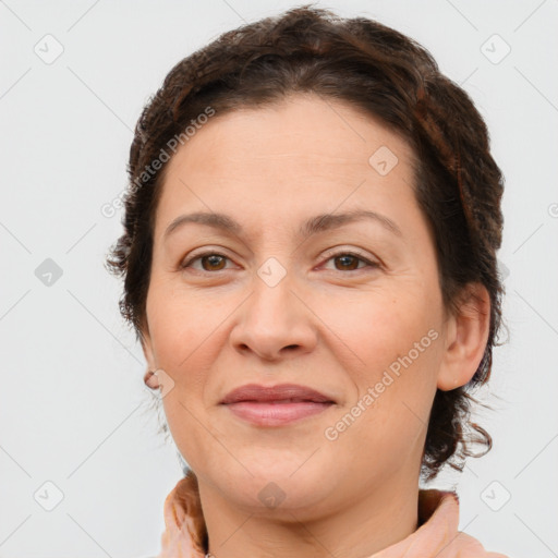 Joyful white adult female with short  brown hair and brown eyes