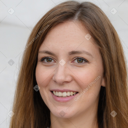 Joyful white young-adult female with long  brown hair and grey eyes