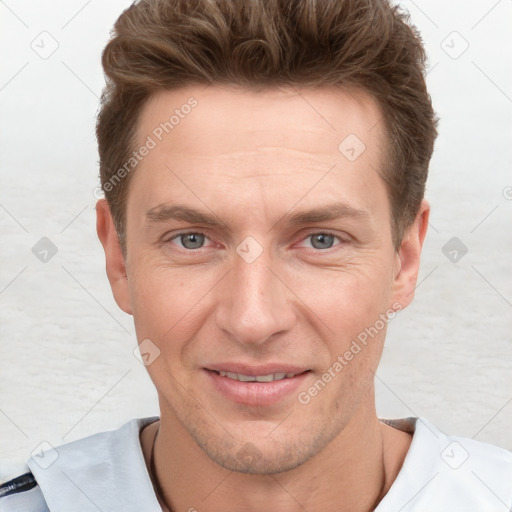 Joyful white adult male with short  brown hair and grey eyes