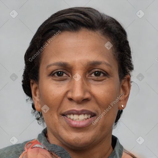 Joyful latino adult female with short  brown hair and brown eyes