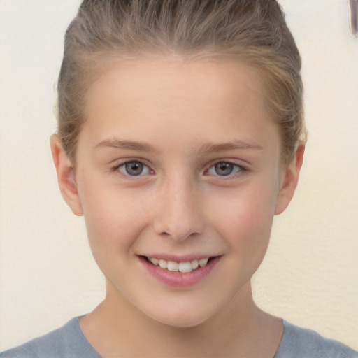 Joyful white child female with short  brown hair and brown eyes