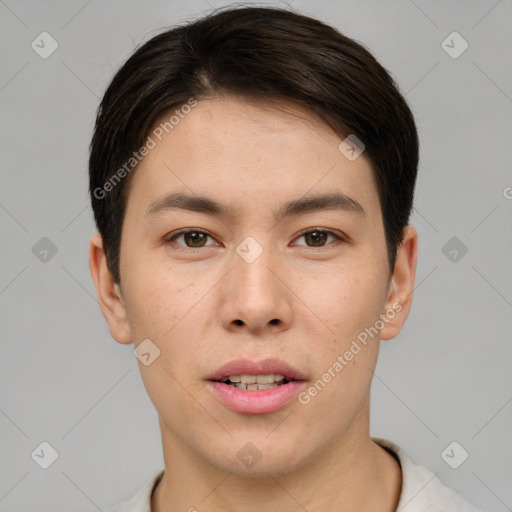 Joyful asian young-adult male with short  brown hair and brown eyes