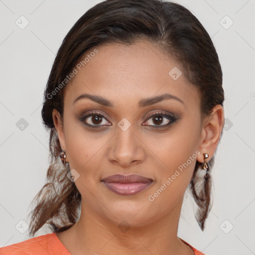 Joyful latino young-adult female with medium  brown hair and brown eyes