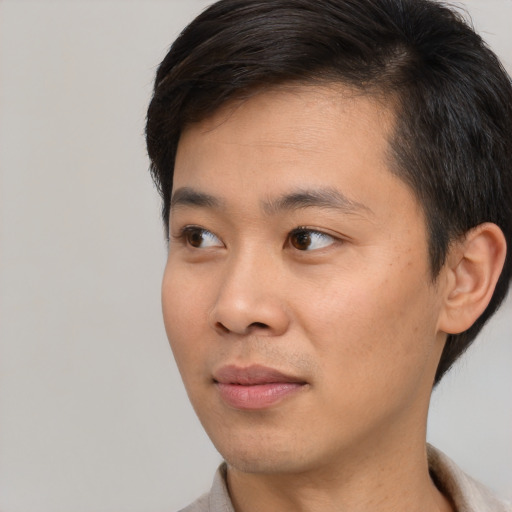 Neutral asian young-adult male with short  black hair and brown eyes