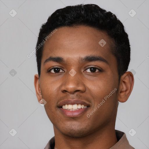 Joyful black young-adult male with short  black hair and brown eyes