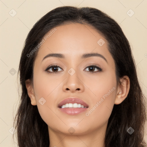 Joyful latino young-adult female with long  black hair and brown eyes