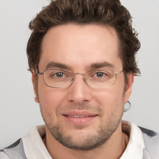 Joyful white adult male with short  brown hair and grey eyes