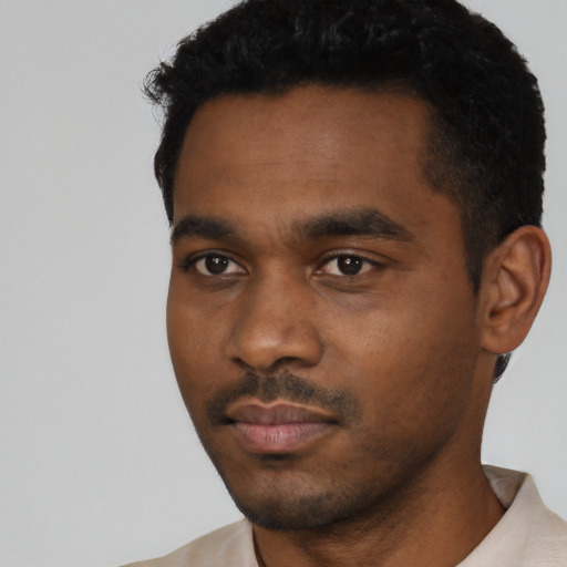 Neutral black young-adult male with short  black hair and brown eyes