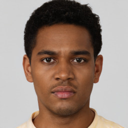 Neutral black young-adult male with short  brown hair and brown eyes