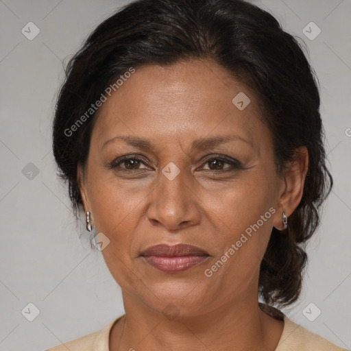 Joyful latino adult female with medium  brown hair and brown eyes