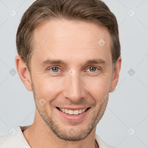 Joyful white adult male with short  brown hair and brown eyes