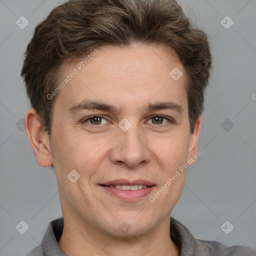 Joyful white adult male with short  brown hair and grey eyes