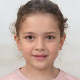 Joyful white child female with short  brown hair and brown eyes