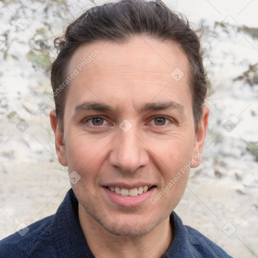 Joyful white adult male with short  brown hair and grey eyes