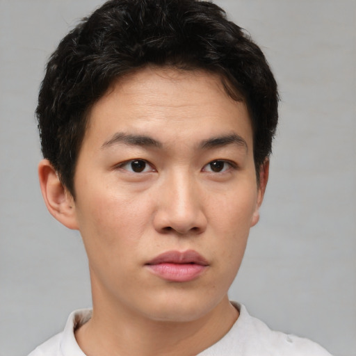 Neutral asian young-adult male with short  brown hair and brown eyes