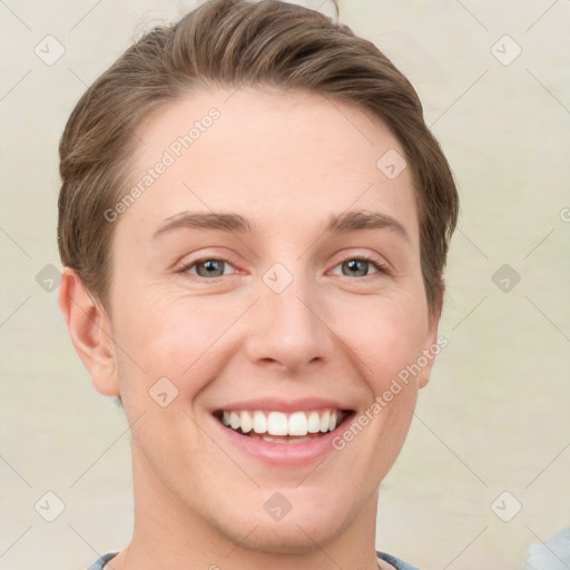 Joyful white young-adult male with short  brown hair and grey eyes