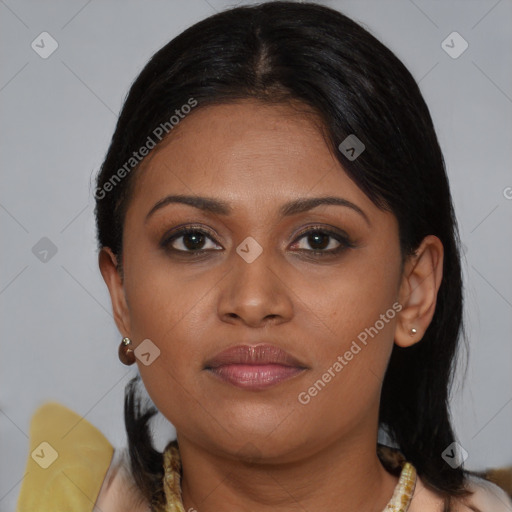 Joyful black young-adult female with medium  brown hair and brown eyes