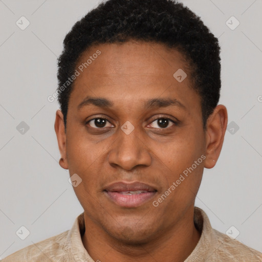 Joyful black adult male with short  black hair and brown eyes