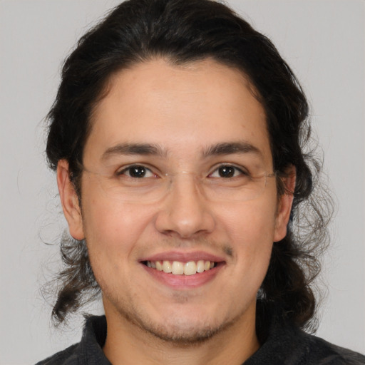 Joyful white young-adult male with medium  brown hair and brown eyes