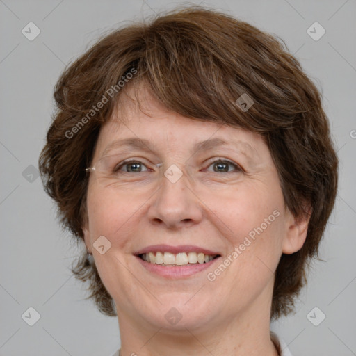 Joyful white adult female with medium  brown hair and grey eyes