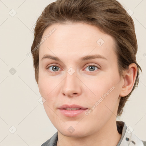 Joyful white young-adult female with short  brown hair and grey eyes