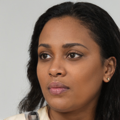 Neutral black young-adult female with long  black hair and brown eyes