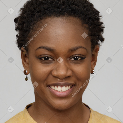 Joyful black young-adult female with short  brown hair and brown eyes