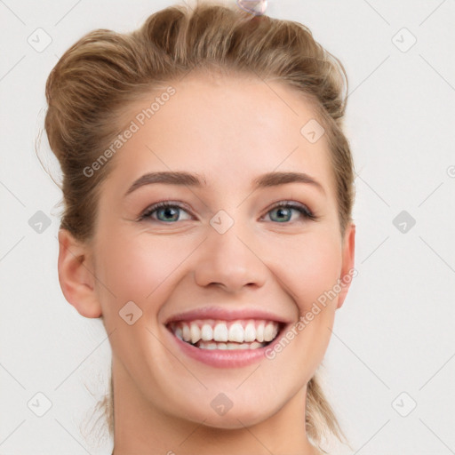 Joyful white young-adult female with medium  brown hair and blue eyes