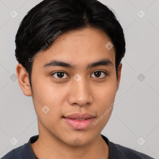 Joyful latino young-adult male with short  black hair and brown eyes
