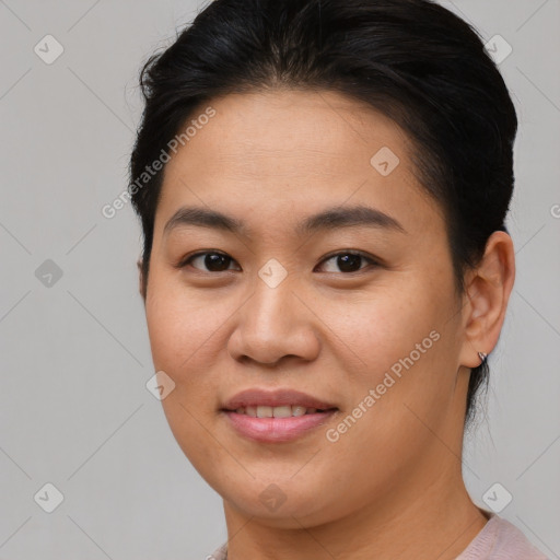 Joyful asian young-adult female with short  brown hair and brown eyes