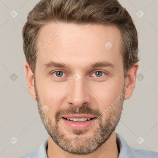 Joyful white adult male with short  brown hair and brown eyes