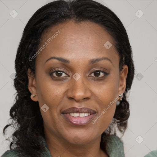 Joyful black adult female with medium  brown hair and brown eyes