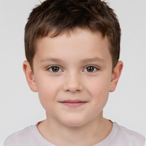 Joyful white child male with short  brown hair and brown eyes