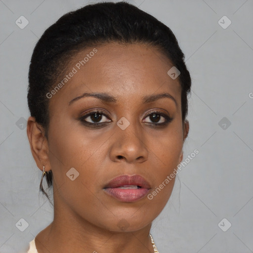 Joyful black young-adult female with long  brown hair and brown eyes