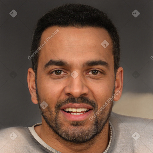 Joyful black young-adult male with short  brown hair and brown eyes