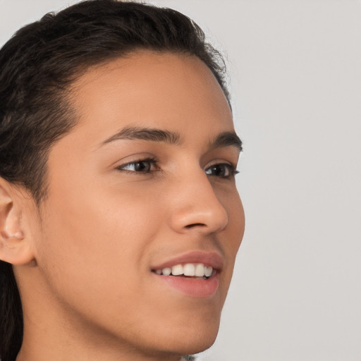 Joyful white young-adult male with medium  brown hair and brown eyes