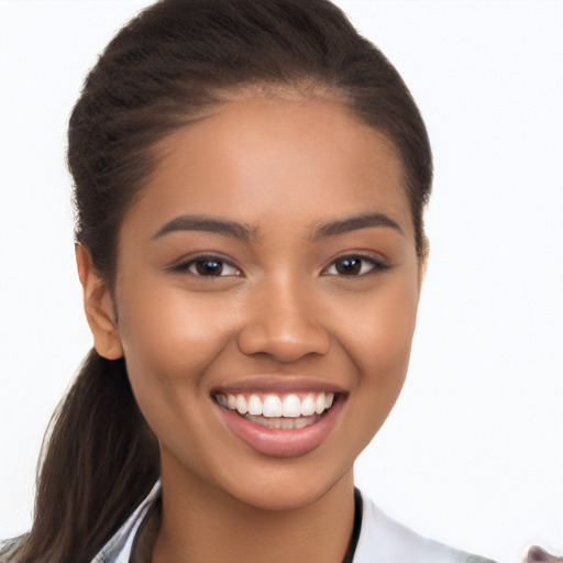 Joyful latino young-adult female with long  brown hair and brown eyes