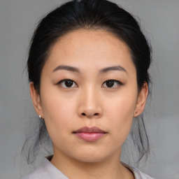 Neutral asian young-adult female with medium  brown hair and brown eyes