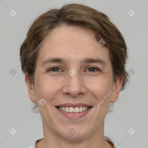 Joyful white adult male with short  brown hair and grey eyes