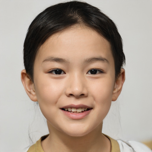 Joyful white child female with short  brown hair and brown eyes