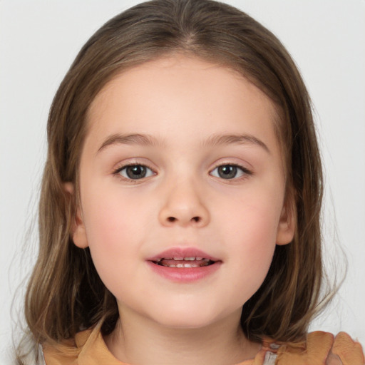 Joyful white child female with medium  brown hair and brown eyes